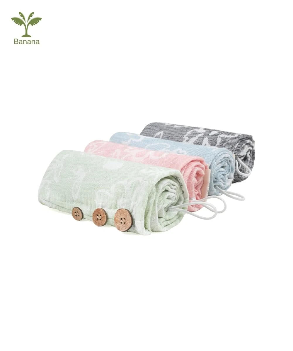 Set of folded Banana Jacquard floral hair towels in pastel colors with wooden buttons on a white background.