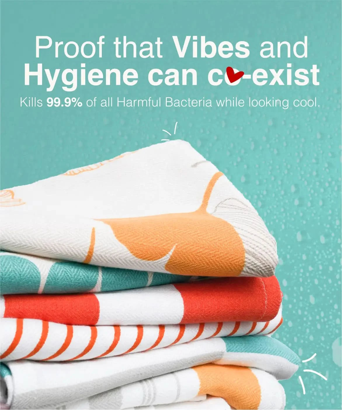 Stack of colorful towels with text about hygiene and bacteria-killing properties on a teal background