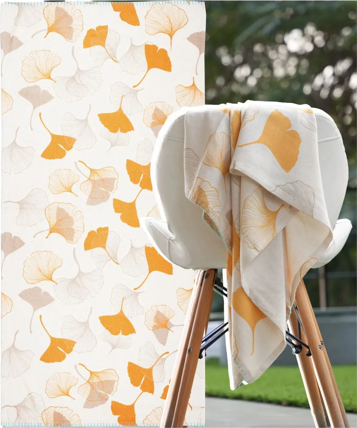 Towel with floral pattern draped over a chair outdoors