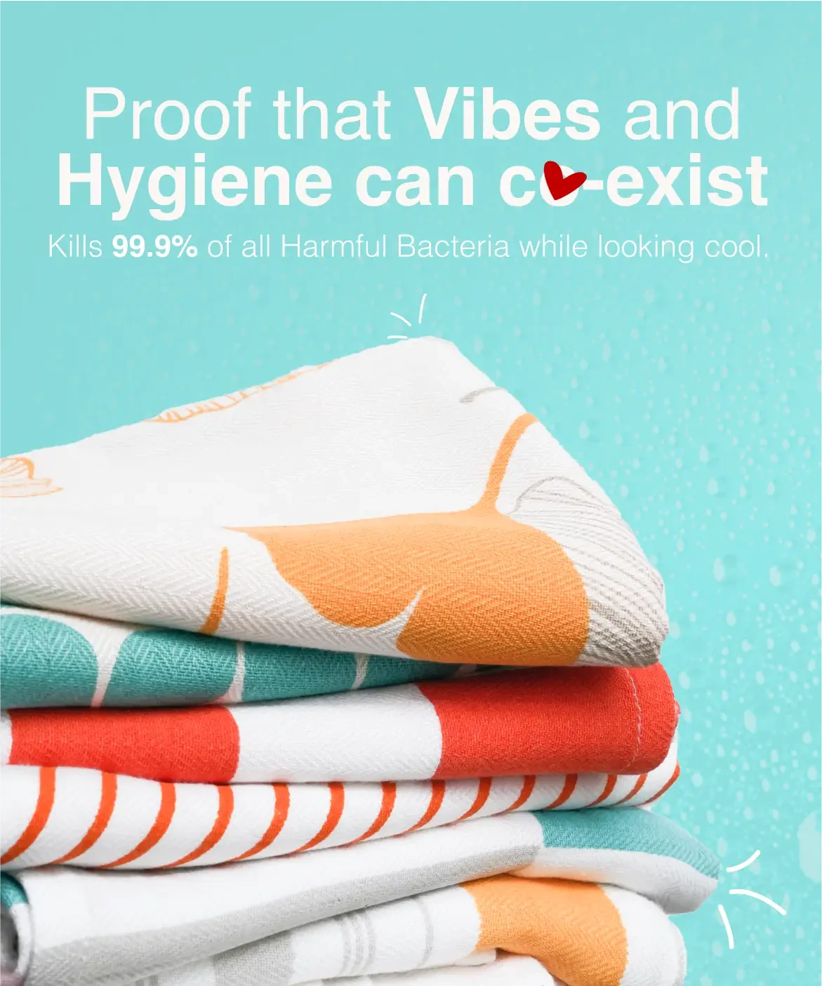 Stack of colorful towels with text about hygiene and bacteria-killing properties on a blue background